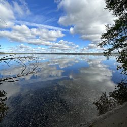 ESLA Drone image of a lake with clouds reflected